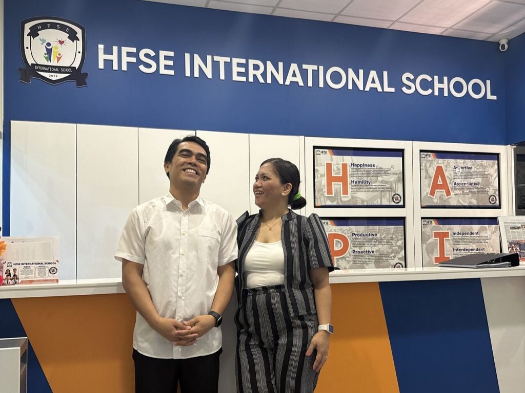 The two school founders smiling happily.