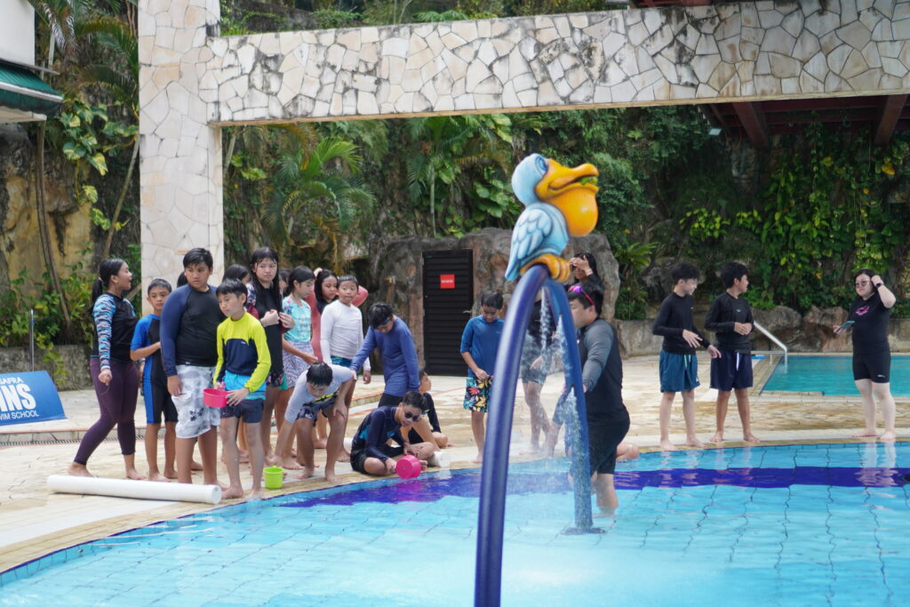Students in Singapore dressed in their swimming attire